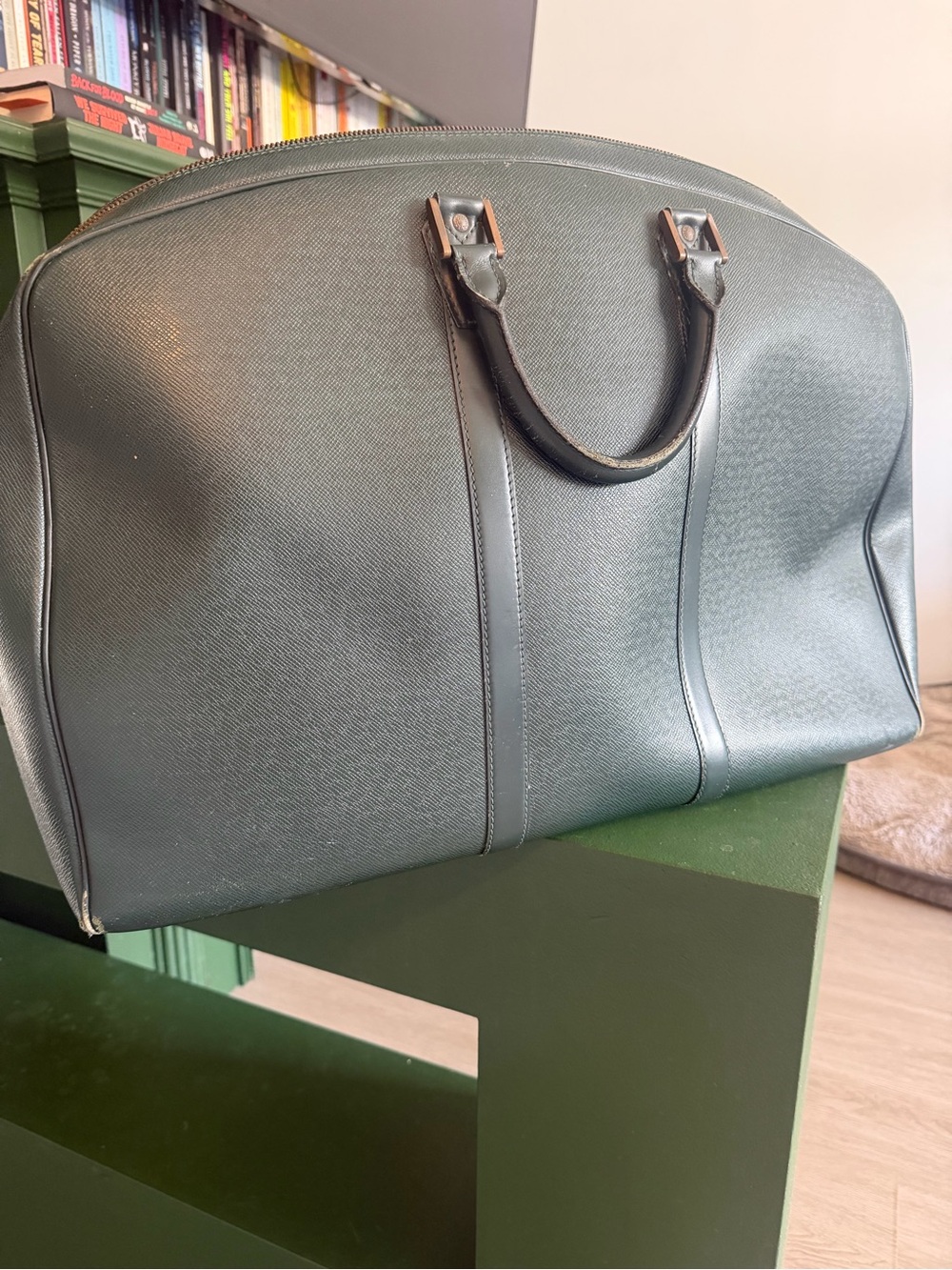 Louis Vuitton Epicea Taiga leather travel bag featuring